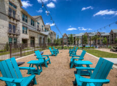 Light blue Adirondack chairs lined up
